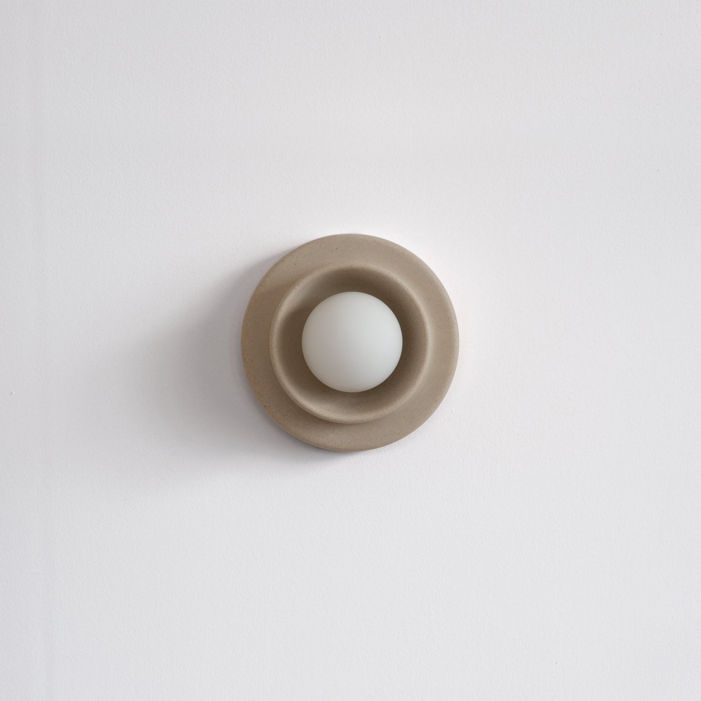 Dune Misewell Q Sconce Handcrafted Ceramic Wall Light on a white wall