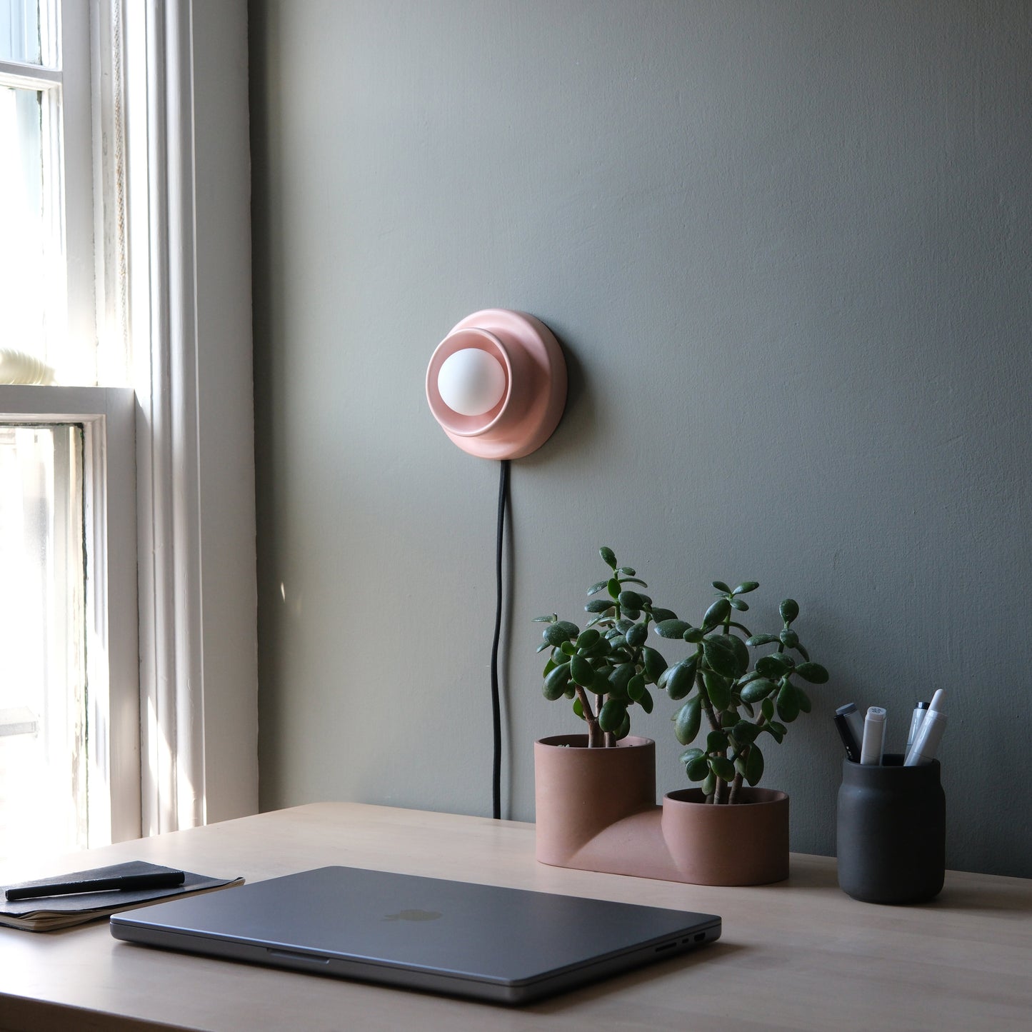 Pink Misewell Q Sconce Handcrafted Ceramic Wall Light on a white wall