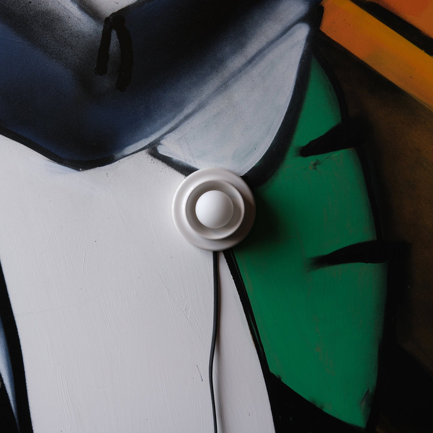 White Misewell Q Sconce Handcrafted Ceramic Wall Light on a white wall