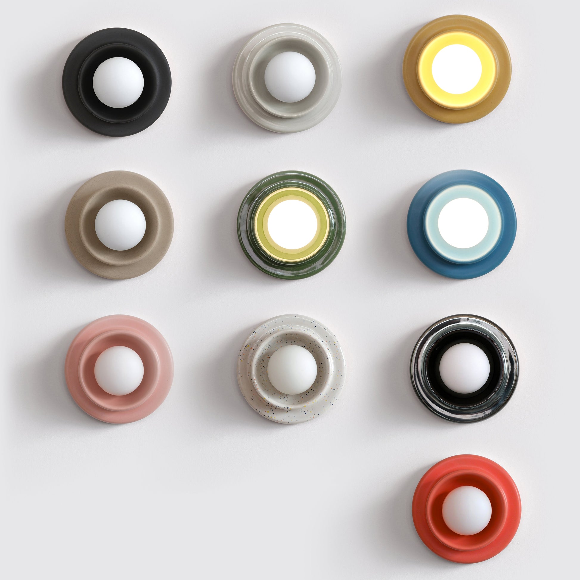 Misewell Q Sconce Handcrafted Ceramic Wall Light Variants on a white wall