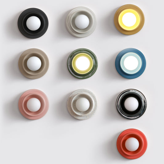 Misewell Q Sconce Handcrafted Ceramic Wall Light Variants on a white wall