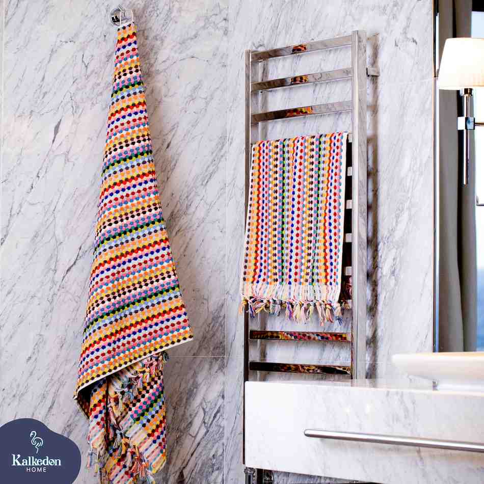 Rainbow Premium Organic Turkish Jacquard Bath Towel – Oversized & Plush  hanging on a towel rack against a marble wall.