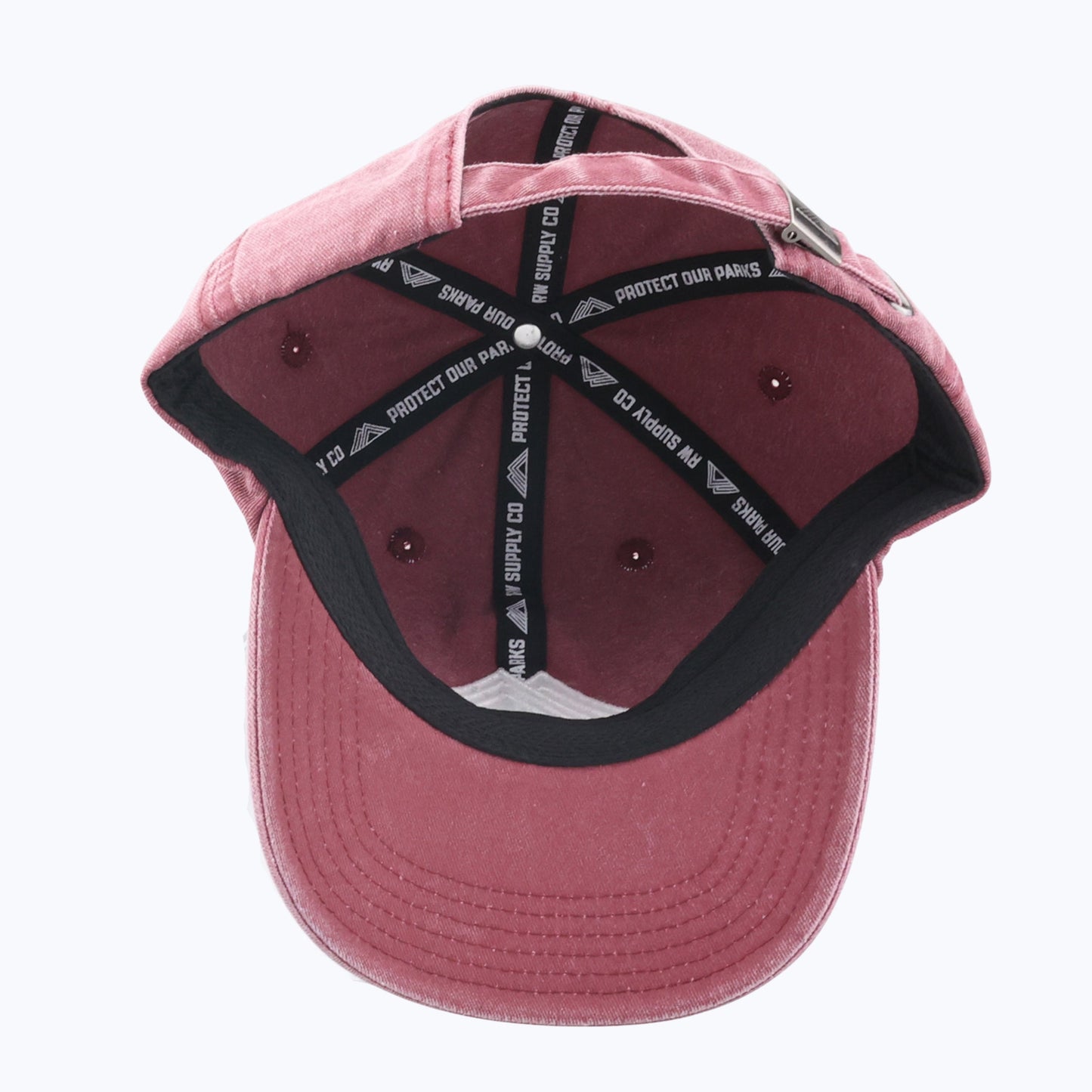 Underside of a Rainier Watch Vintage Wash Dad Cap in Maroon on a white background