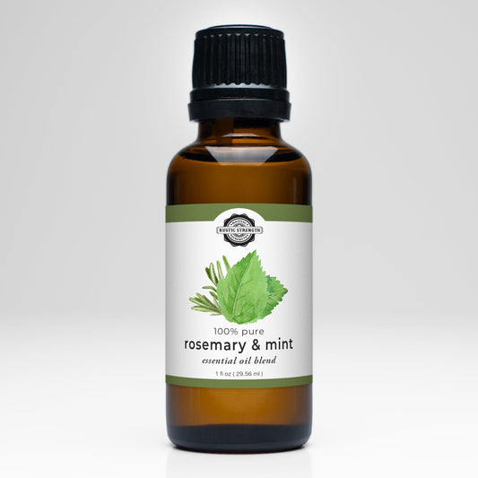 Bottle of rosemary and mint essential oil blend on a white background