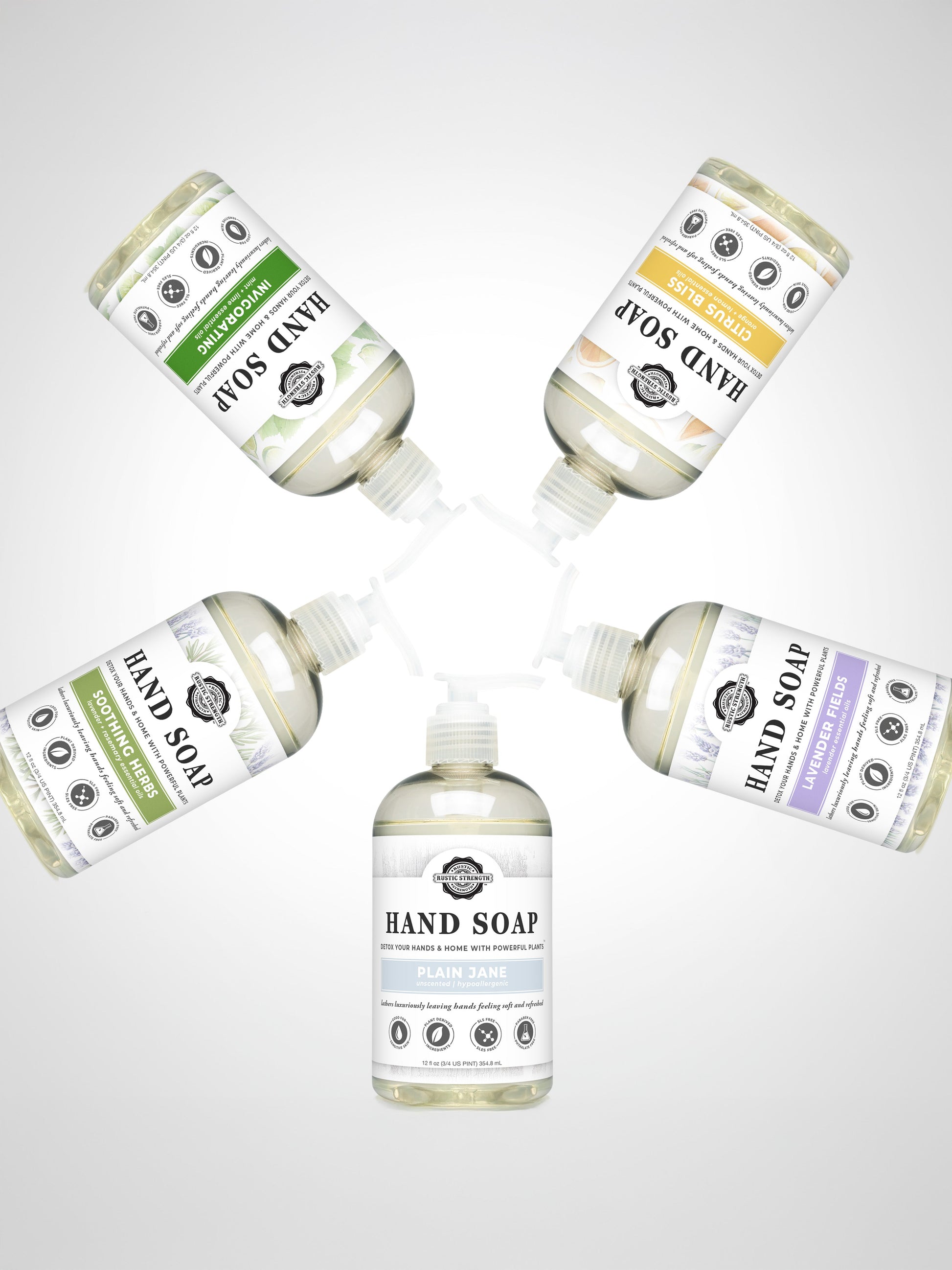 Five bottles of Rustic Strength Hand Soap product line on a light gray background.