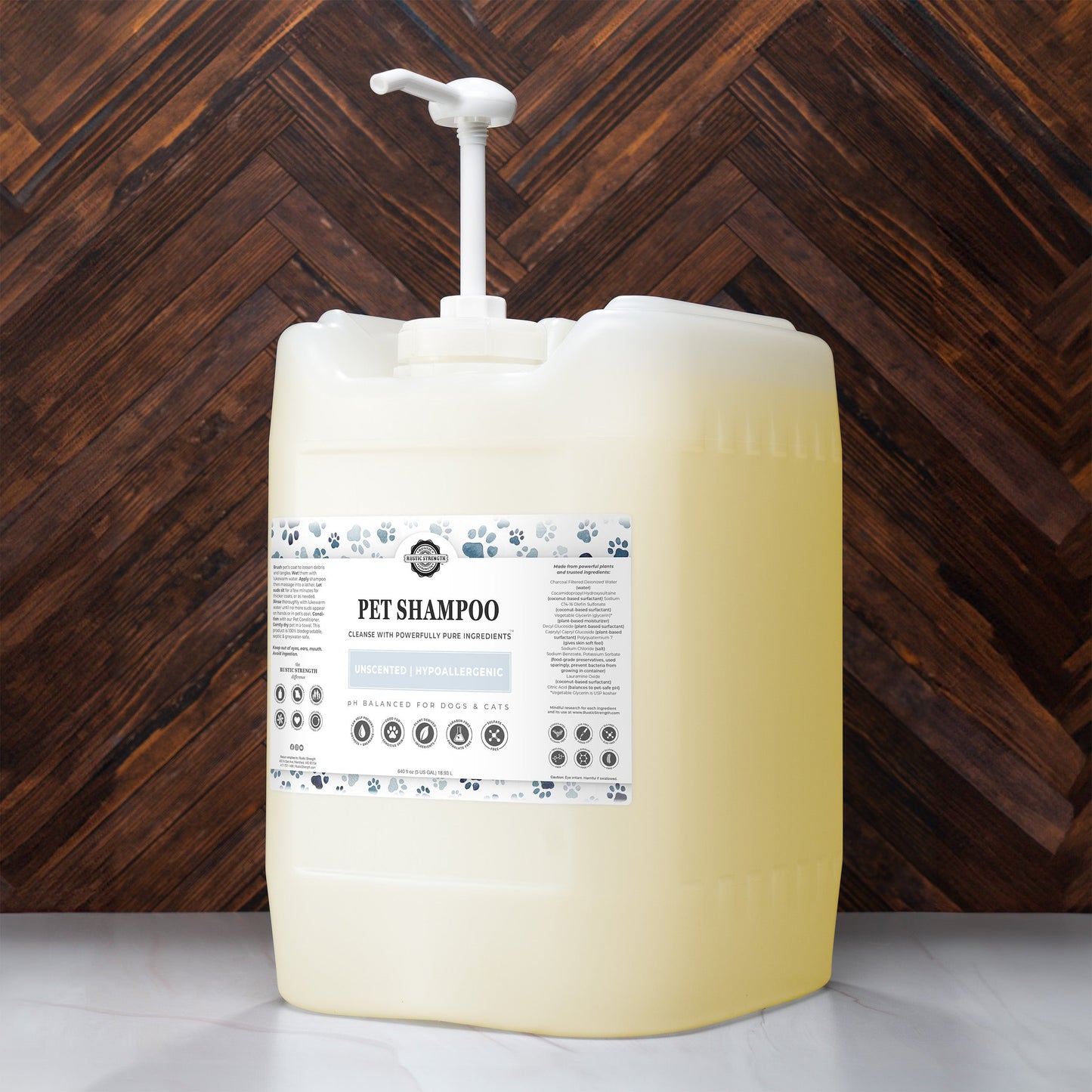 5 gallon container of pet shampoo with a pump against a wooden background