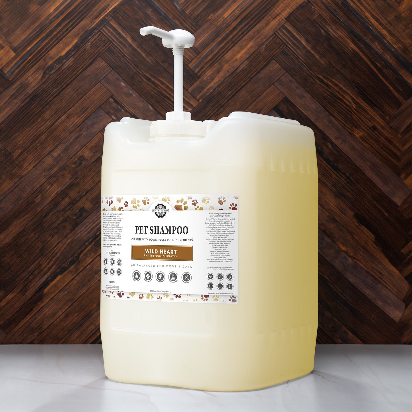 5 gallon container of pet shampoo with a pump against a wooden background