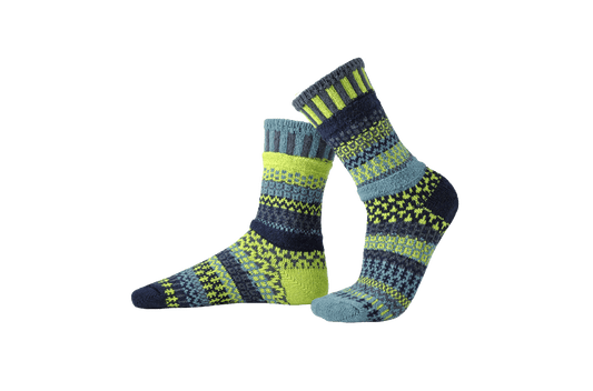 Pair of mismatched Solmate Lemongrass Crew Socks on a transparent background