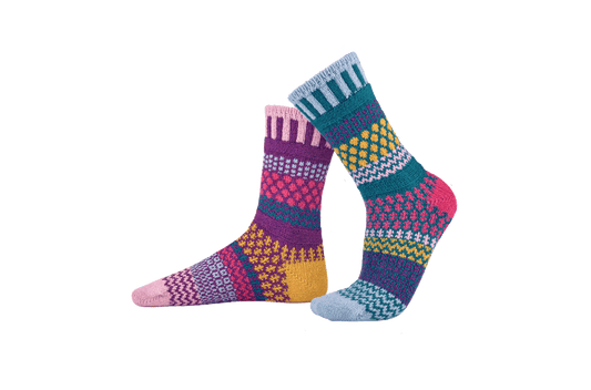 Solmate Petunia Crew Socks - Mismatched, colorful patterned socks on a white background