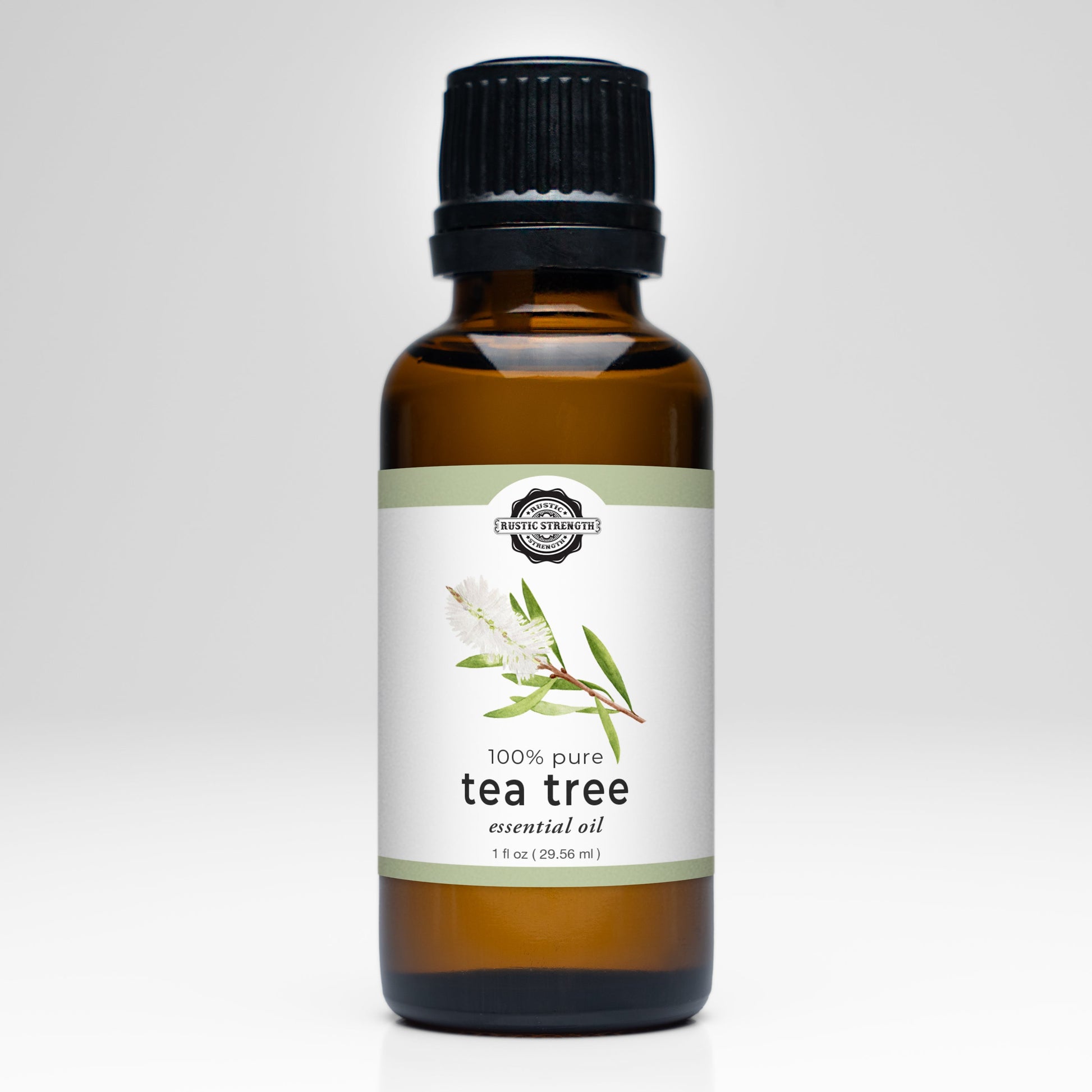Bottle of 100% pure tea tree essential oil on a white background