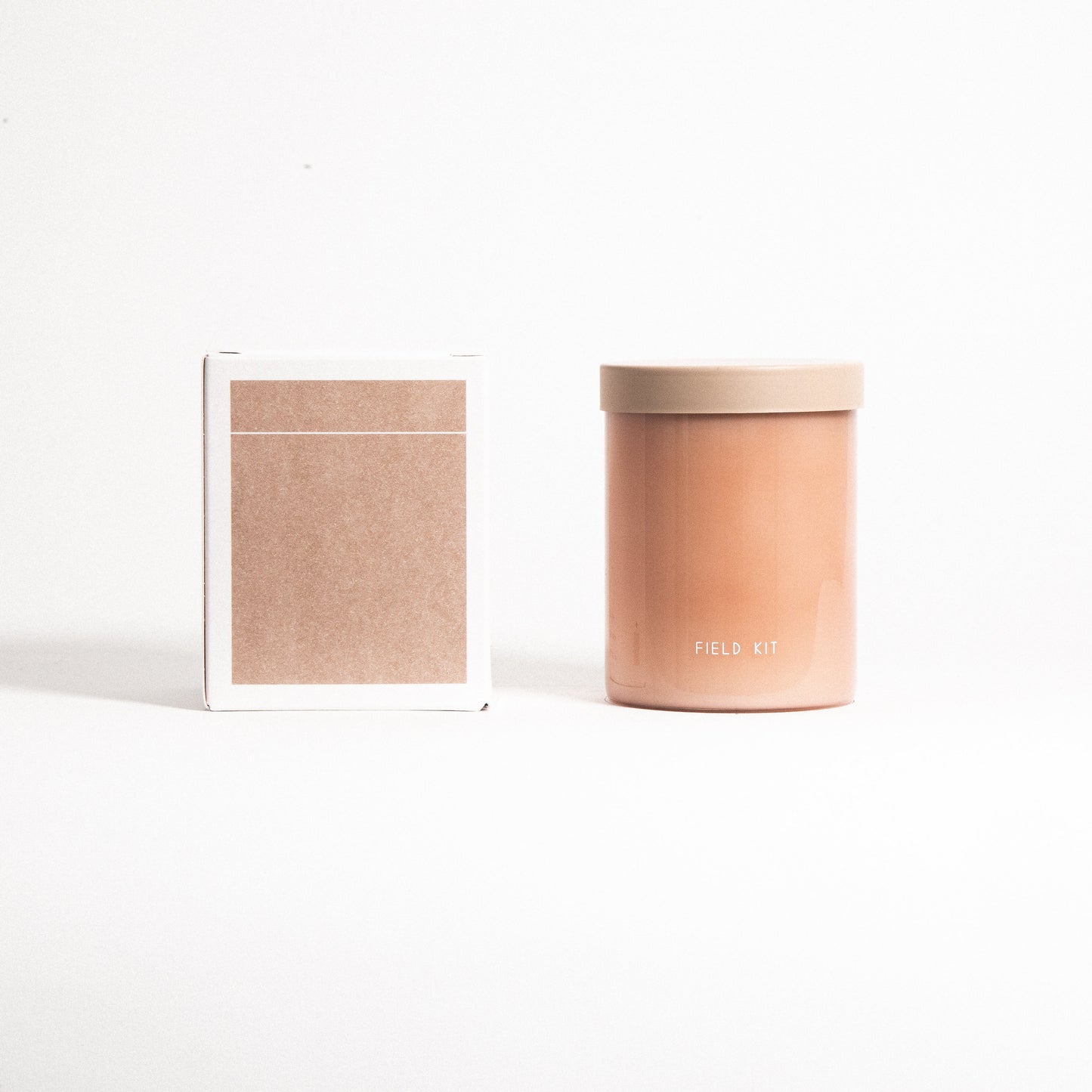 The Floris Candle by Field Kit in Reusable Glass Jar and Plastic Free Packaging. Top notes: apple blossom; Mid notes: lilac + rose; Base notes: jasmine + grass