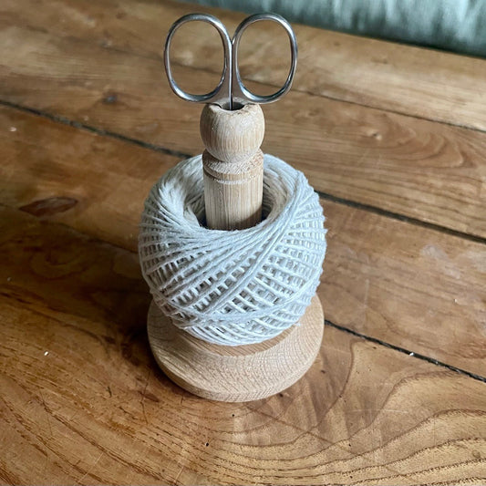 Twine Set, depicting twine on an oak spool with scissors on a wooden surface
