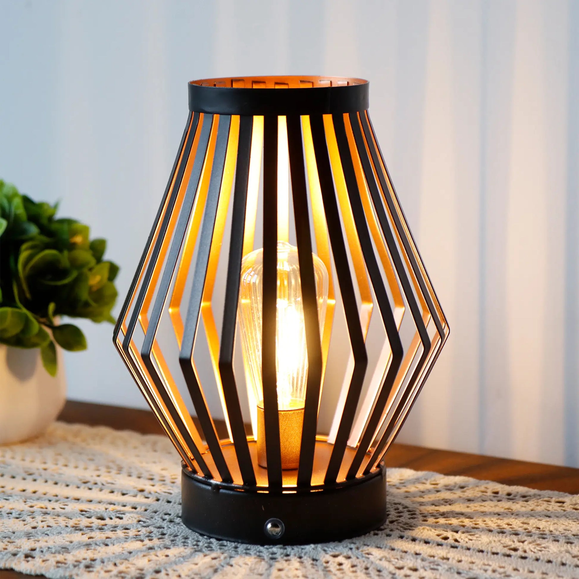 Decorative table lamp with geometric design on a textured surface