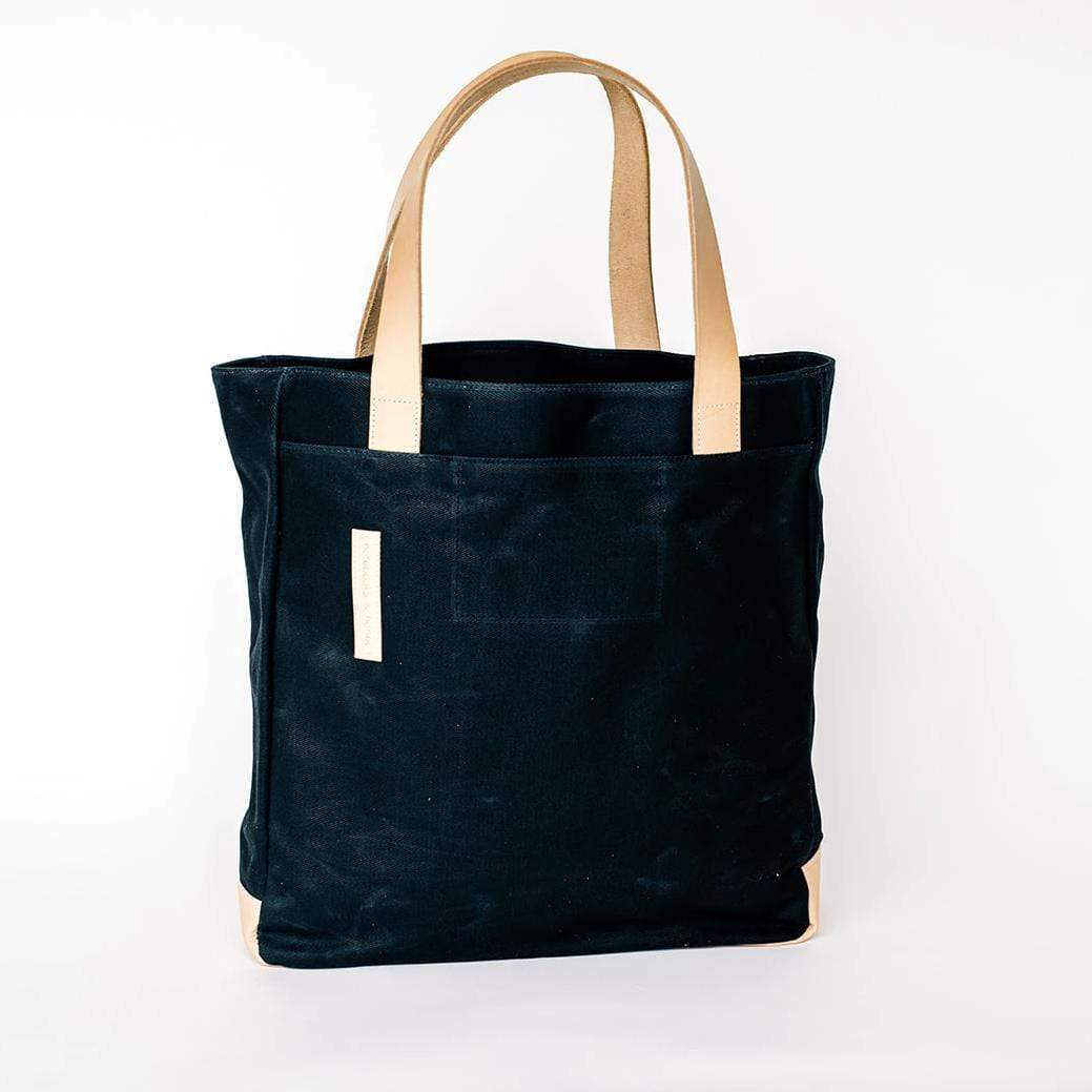 Black Waxed Canvas Tote Bag with Royal Blue Nylon Lining – Durable & Stylish - with beige handles on a white background