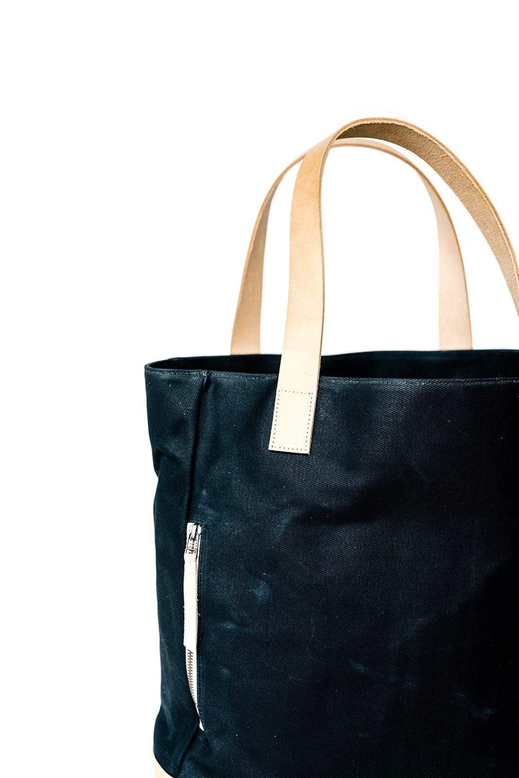 Black Waxed Canvas Tote Bag with Royal Blue Nylon Lining – Durable & Stylish - with beige handles on a white background
