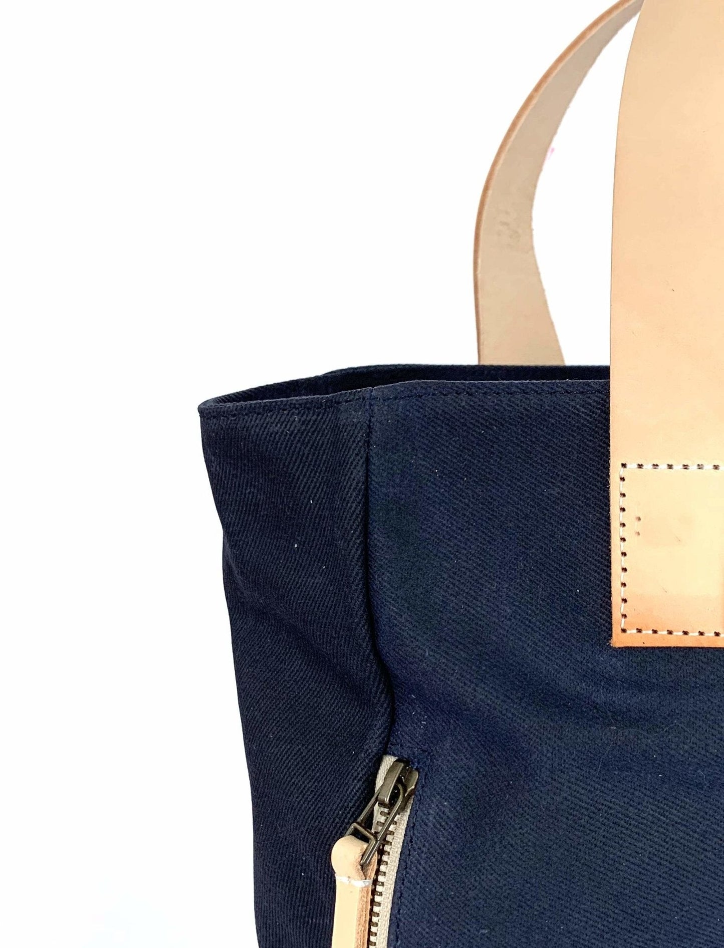 Waxed Canvas Tote Bag – Navy with Bright Pink Lining, Durable & Eco-Friendly, with beige handle and zipper on a white background