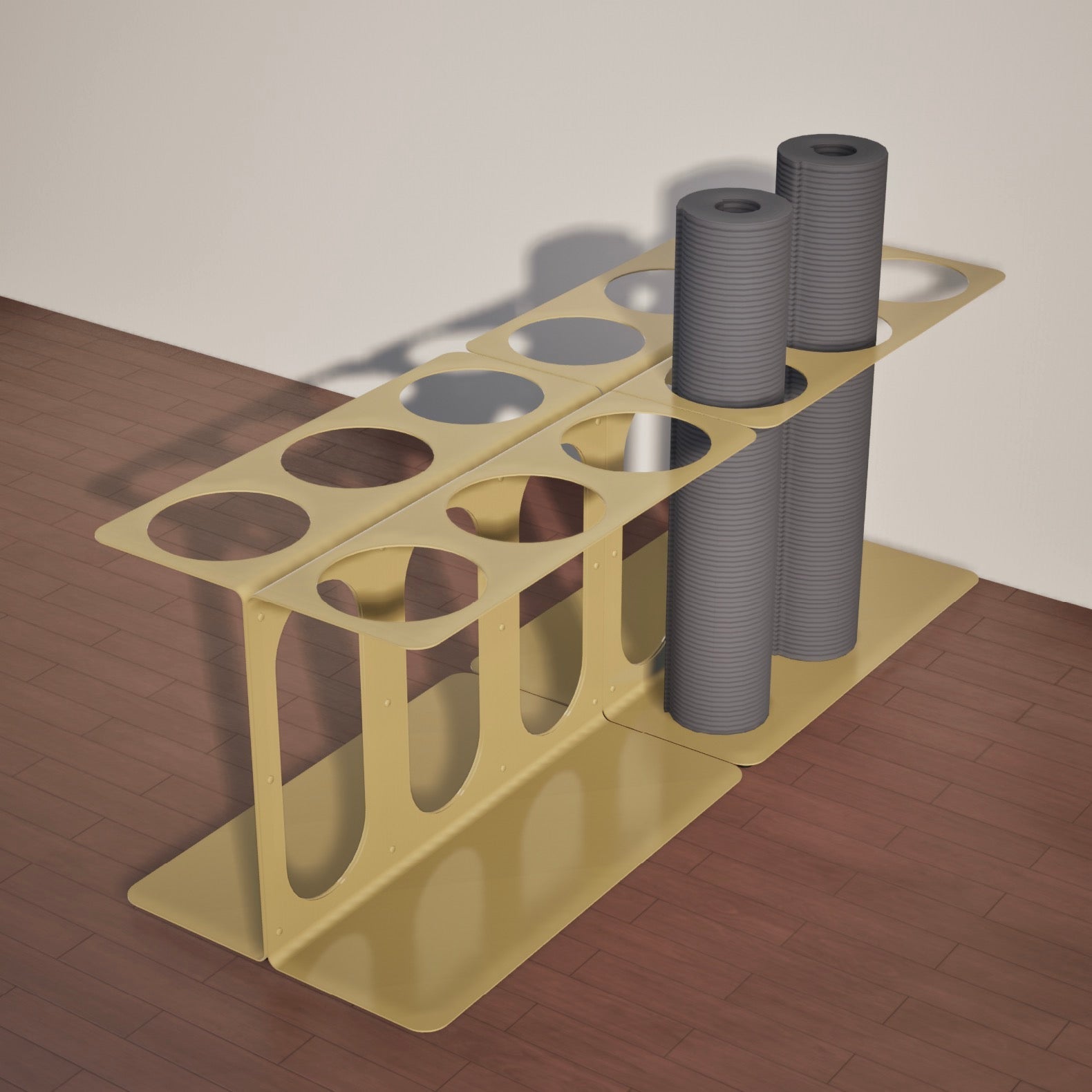 Two yellow Yoke yoga mat stands with two of twelve available slots used on a wooden floor
